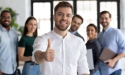 Confident Professional Giving Thumbs Up