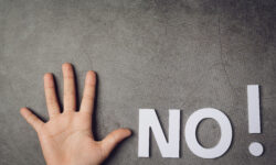 An outstretched hand with the word "NO!"